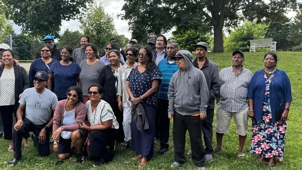 Large group posing in a park