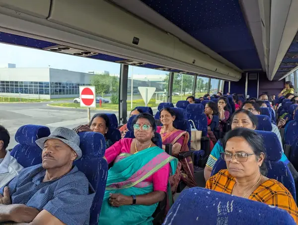 People seated on a tour bus