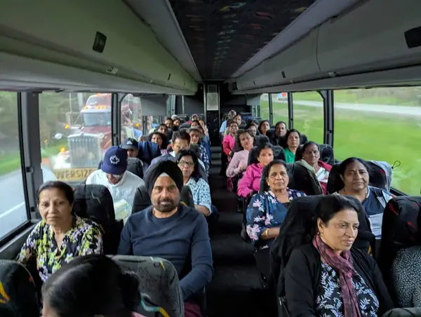 People seated on a tour bus