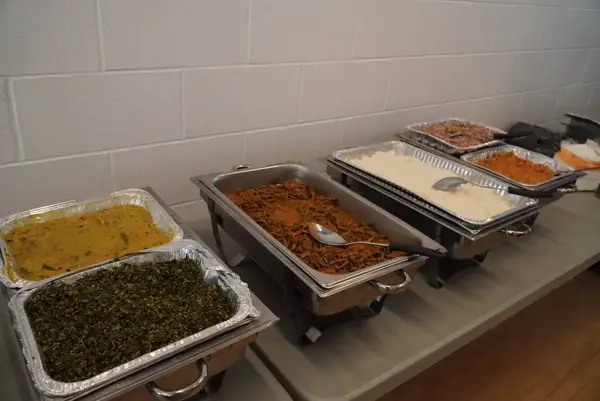 Trays of food on a buffet table