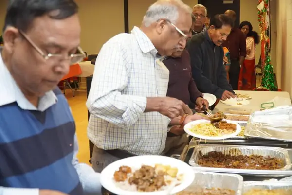 People serving themselves from a buffet