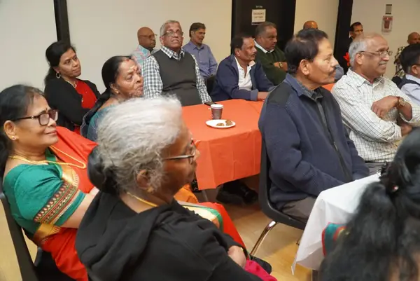 People seated in a hall
