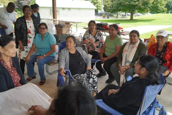 People seated together outdoors