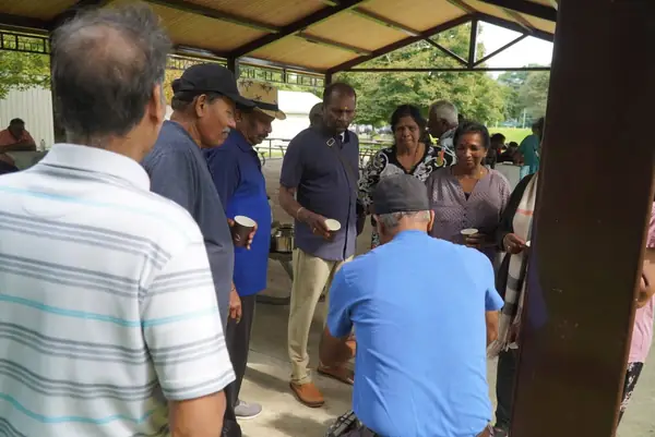 People gathered under a pavilion