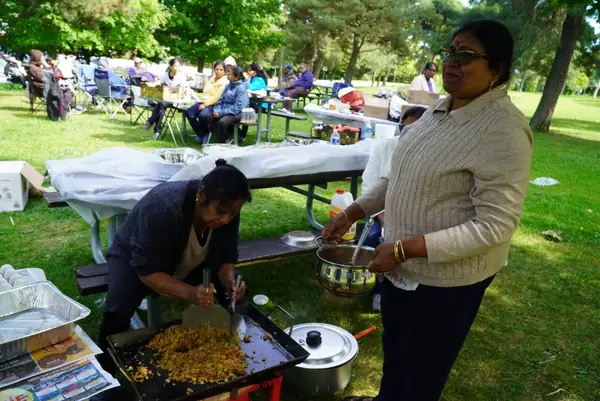 People preparing food outdoors
