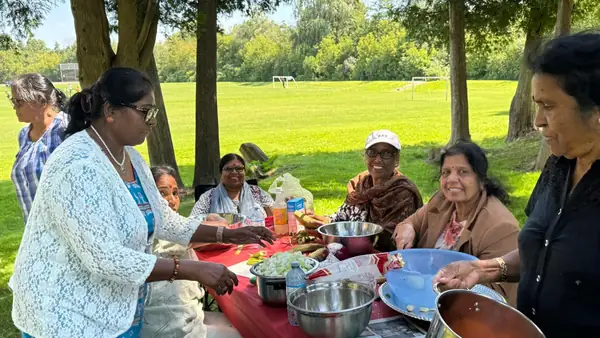 People seated at a table outdoors