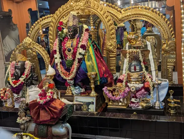 Ornately decorated shrine with deity statues