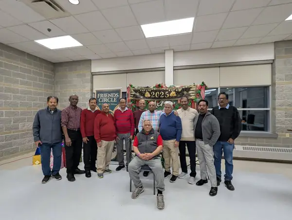 Group of men posing in a hall