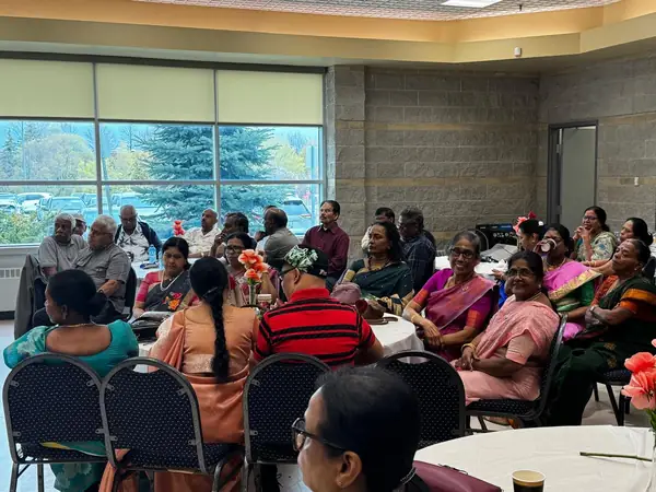 People seated in a hall